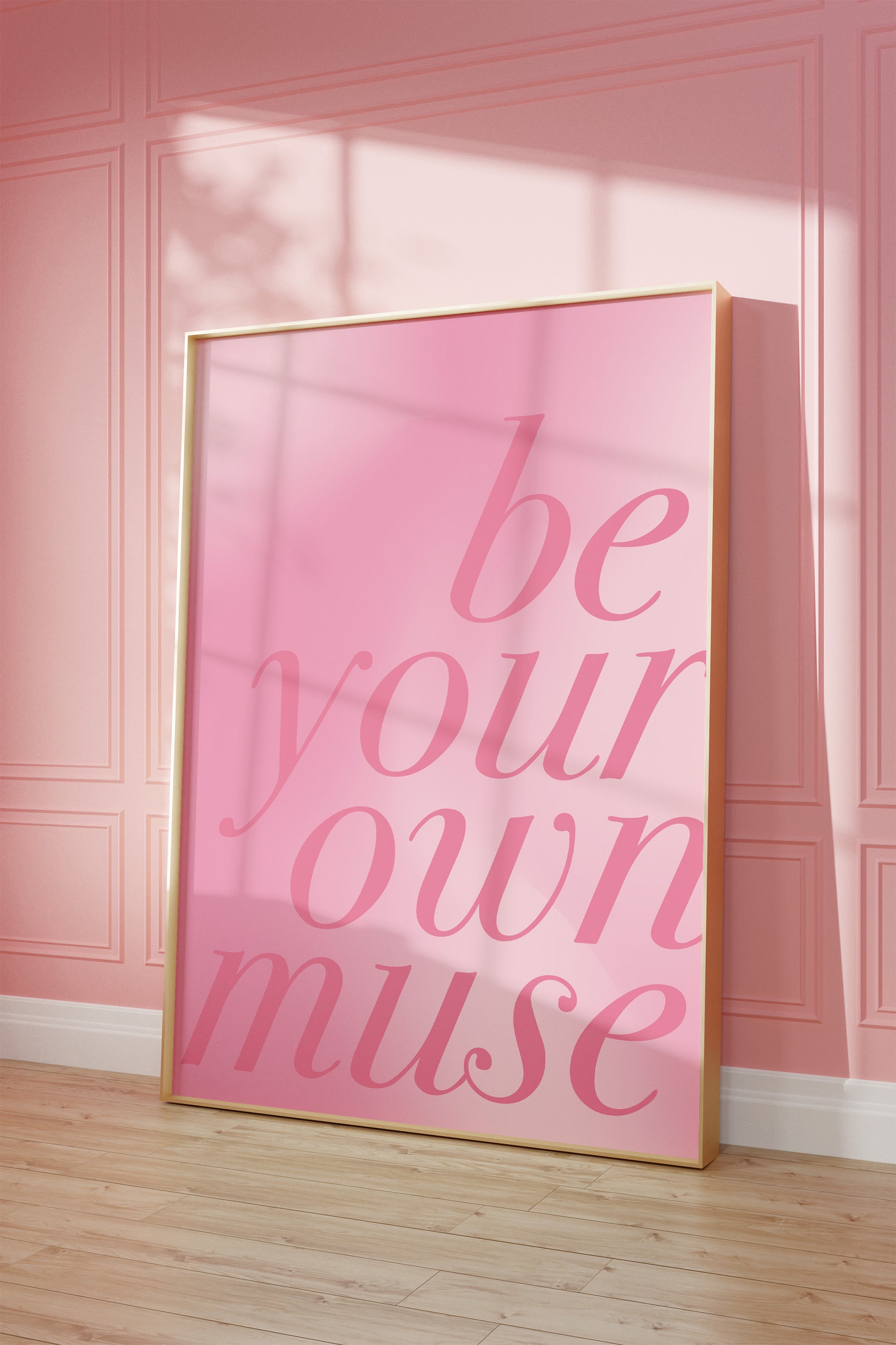 Inspirational pink wall print with gold frame, adding elegance and motivation to any room.