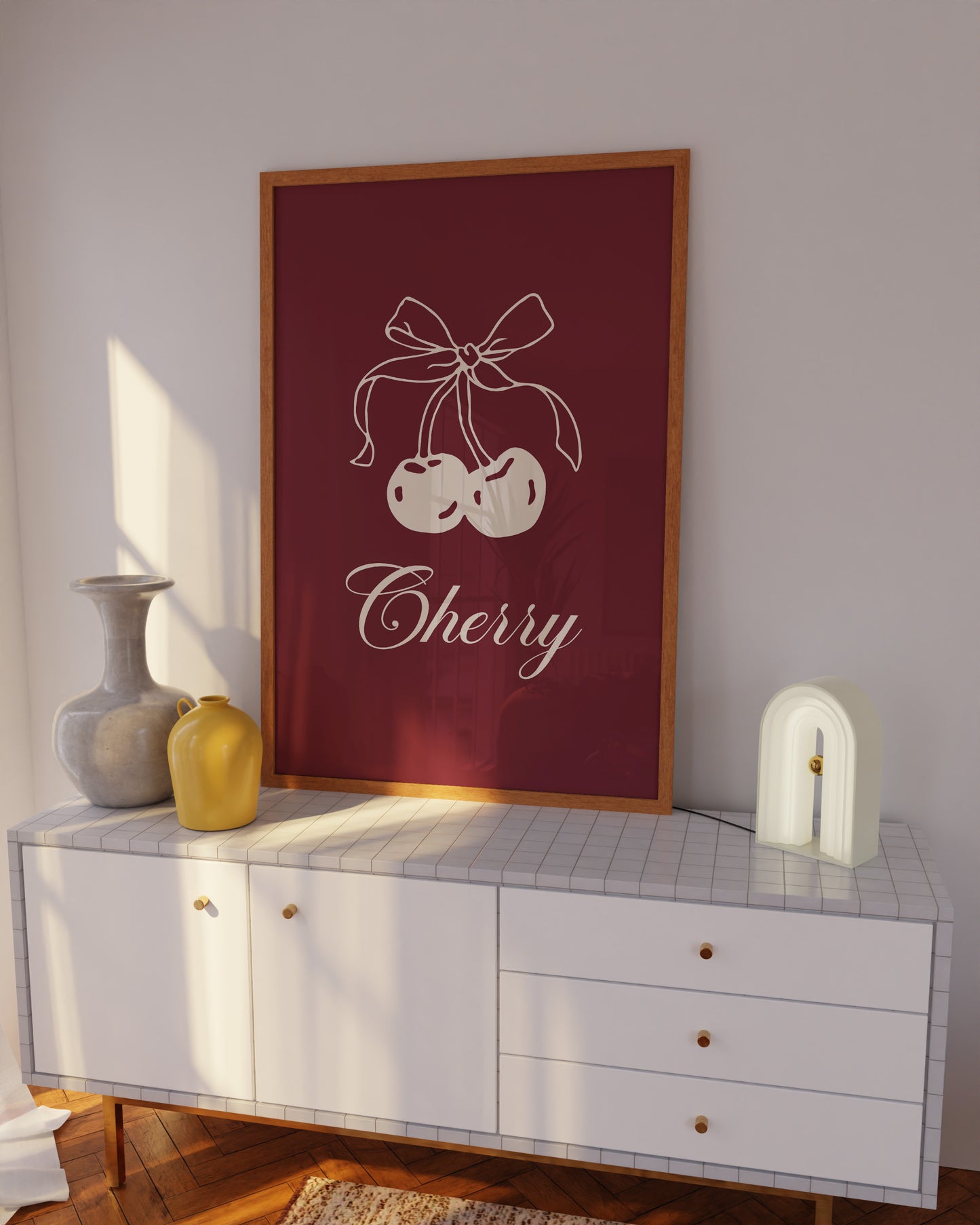 Detailed view of a beige cherry digital print with a hand-drawn bow on a burgundy background.