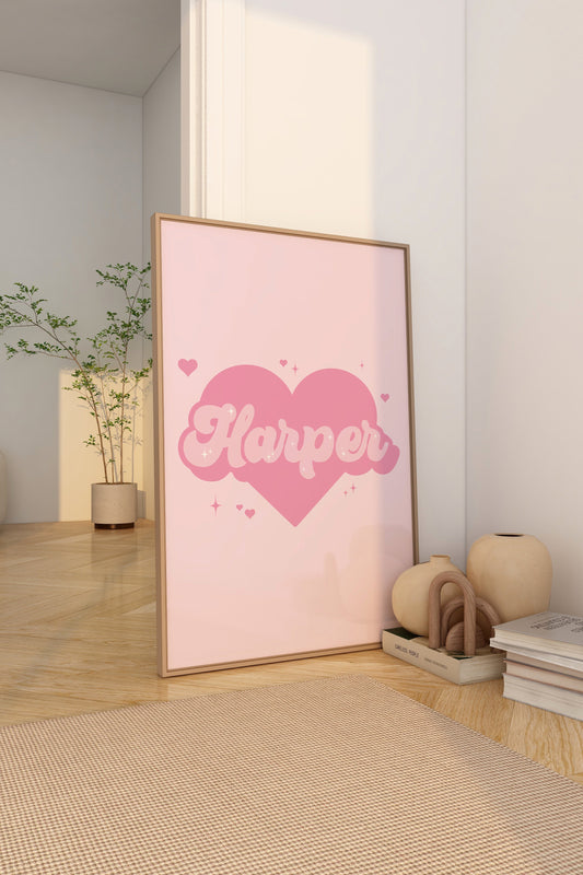 Personalised pink wall art with a name in a heart design, perfect for a girl's bedroom.