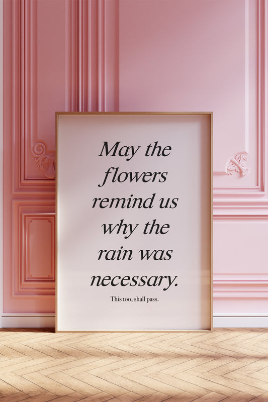 Minimalist inspirational wall art with the quote "May the flowers remind us why the rain was necessary."