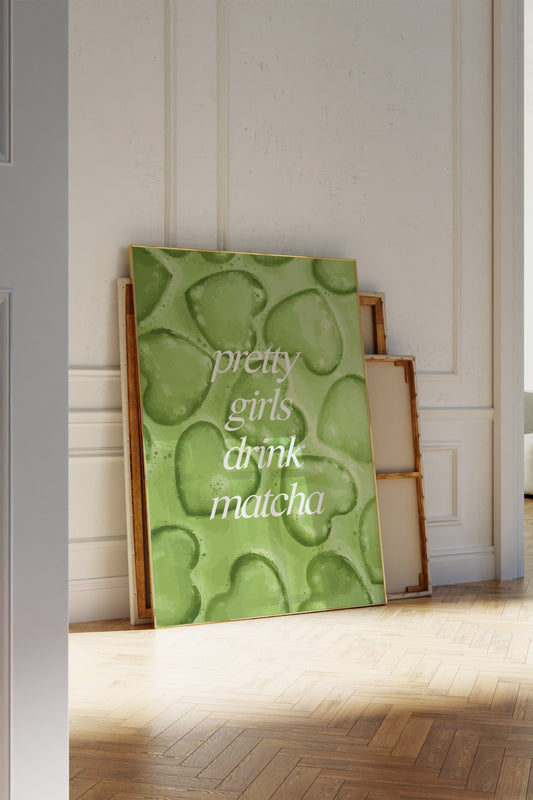 Digital wall art with the quote “pretty girls drink matcha” on iced matcha background.