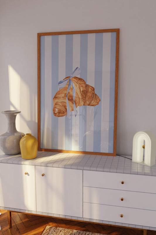 French croissant digital wall art with blue ribbon.